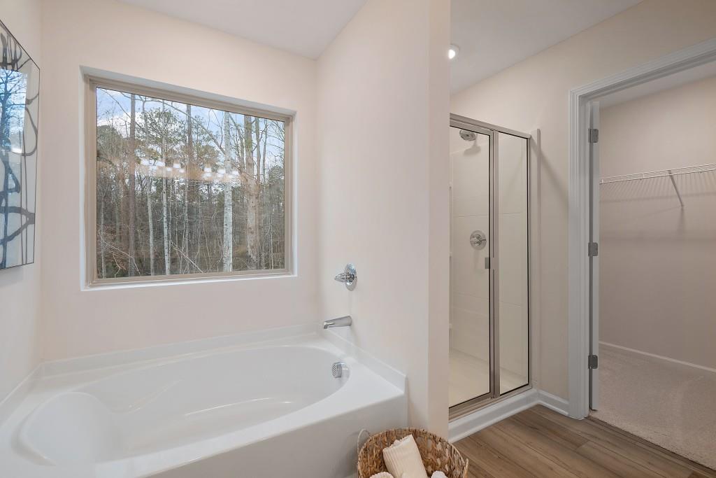 57 Scout Way Newnan, GA 30263 - Photo 33 of 37 a white bath tub sitting next to a window
