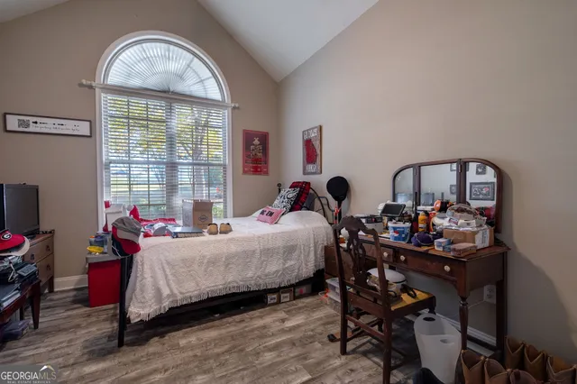 a bed room with a bed and a windows