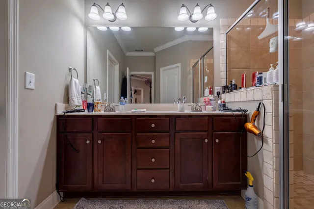 a bathroom with a sink vanity and a mirror