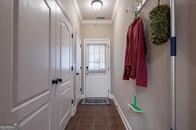 a living room with furniture and a shelf