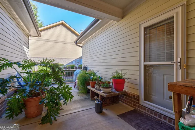 a potted plant sitting in front of a house