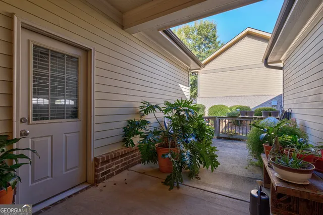 a view of deck with small cabin and wooden floor
