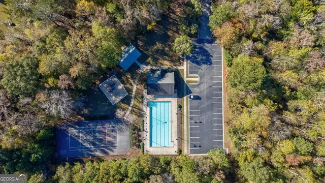 front view of a brick house with a tree