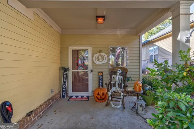 a view of a house with a yard and garage