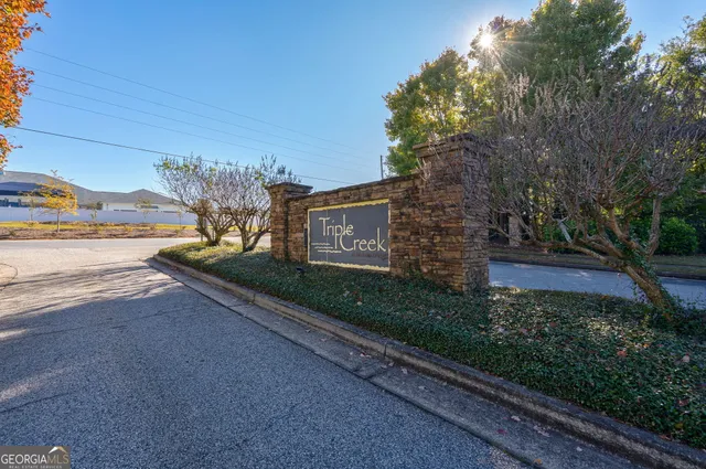 a view of a house with backyard porch and sitting area