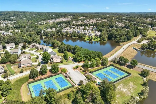 an aerial view of residential houses with outdoor space