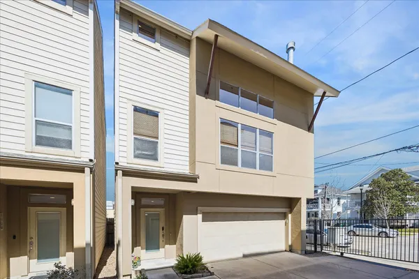 a front view of a house with a garage