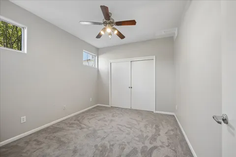 a view of a livingroom with a ceiling fan