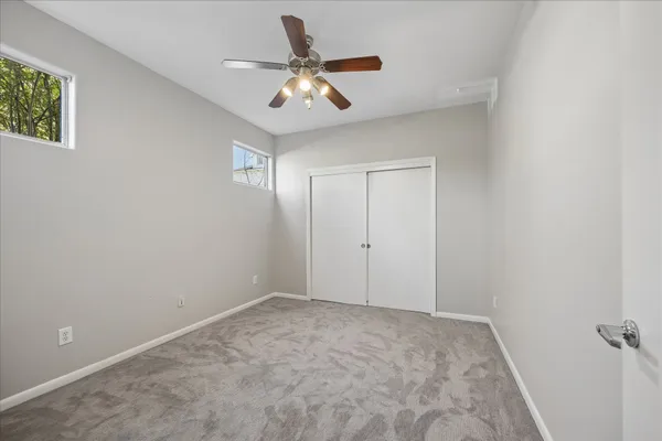a view of a livingroom with a ceiling fan