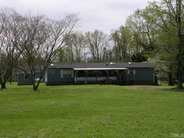 3121 George Hopkins Road Bahama, NC 27503 - Photo 1 of 1 a view of a yard with a house in the background