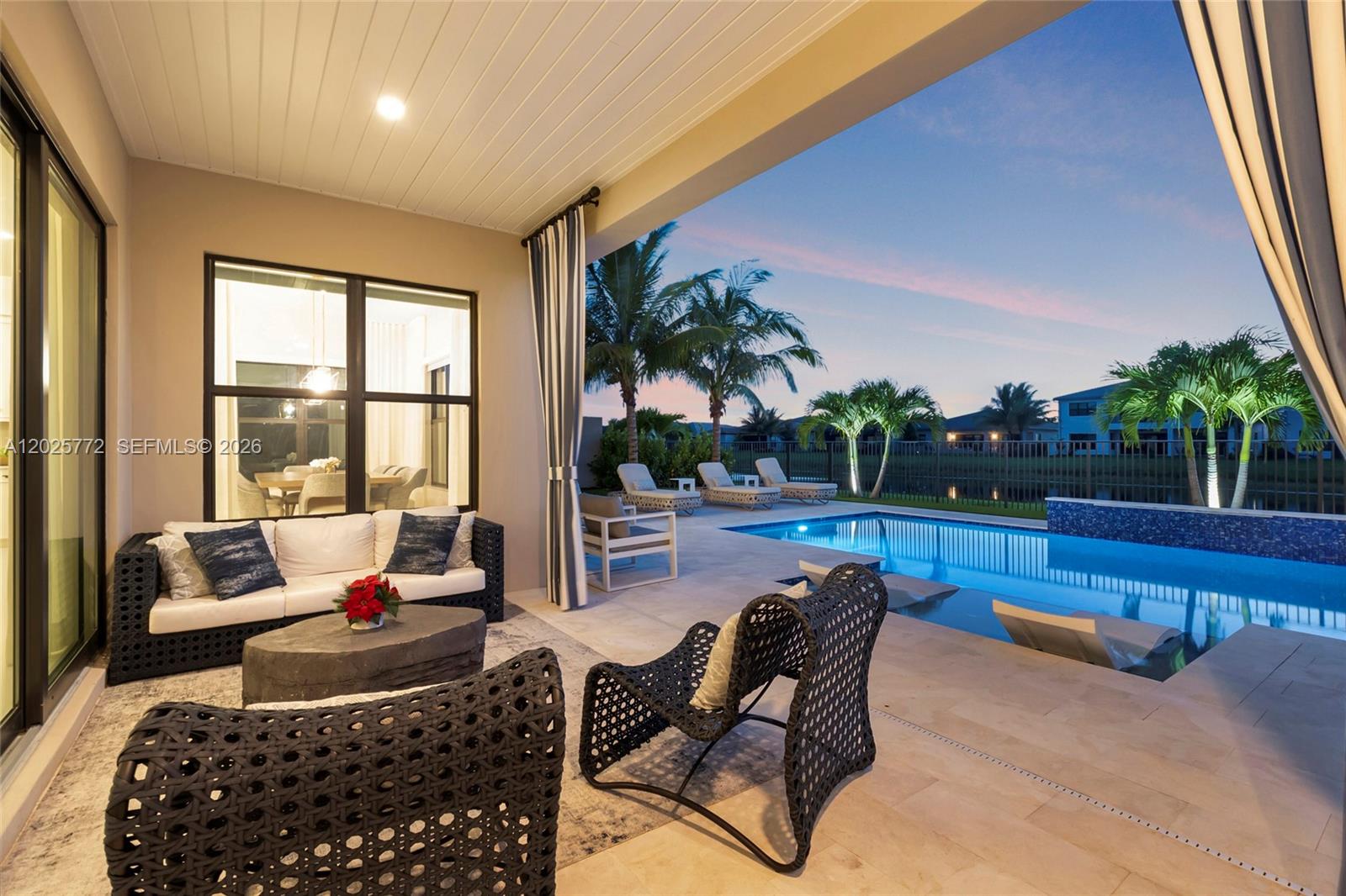 17023 Wandering Wave Avenue Boca Raton, FL 33496 - Photo 67 of 84 a living room with furniture and a floor to ceiling window