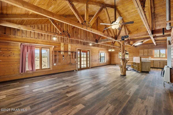 a view of a room with wooden floor