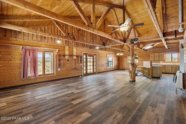 a view of a room with wooden floor
