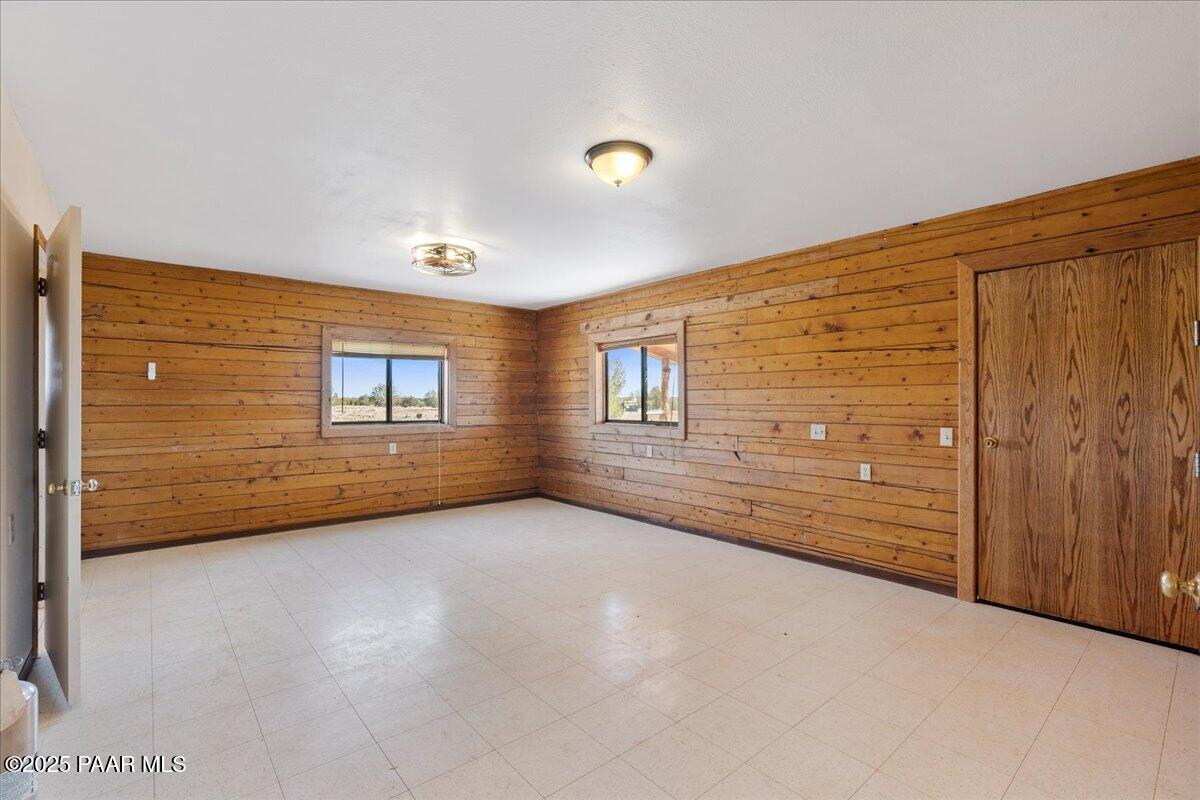 9797 Rocky Rabbit Road Ash Fork, AZ 86320 - Photo 14 of 36 a view of an empty room and wooden floor