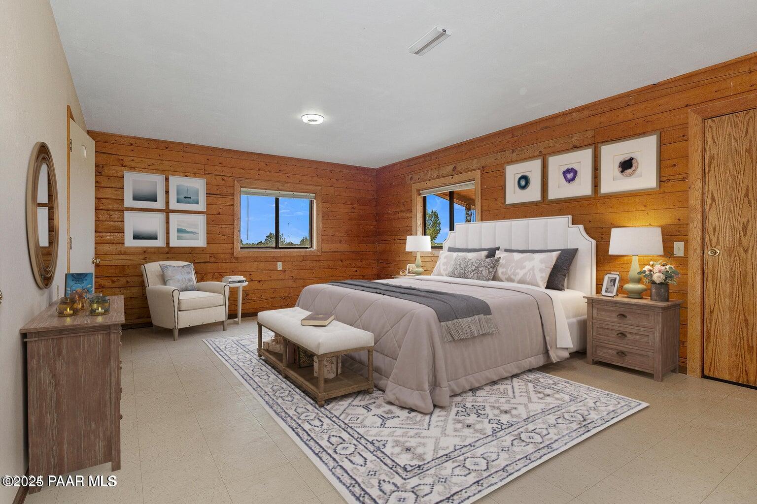 9797 Rocky Rabbit Road Ash Fork, AZ 86320 - Photo 15 of 36 a bedroom with furniture and a large window