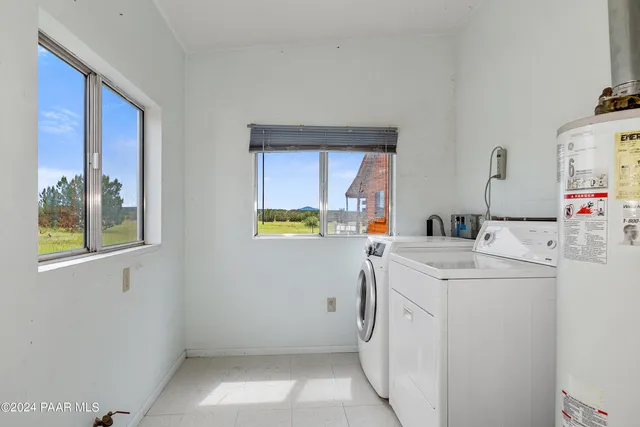 a utility room with dryer and washer