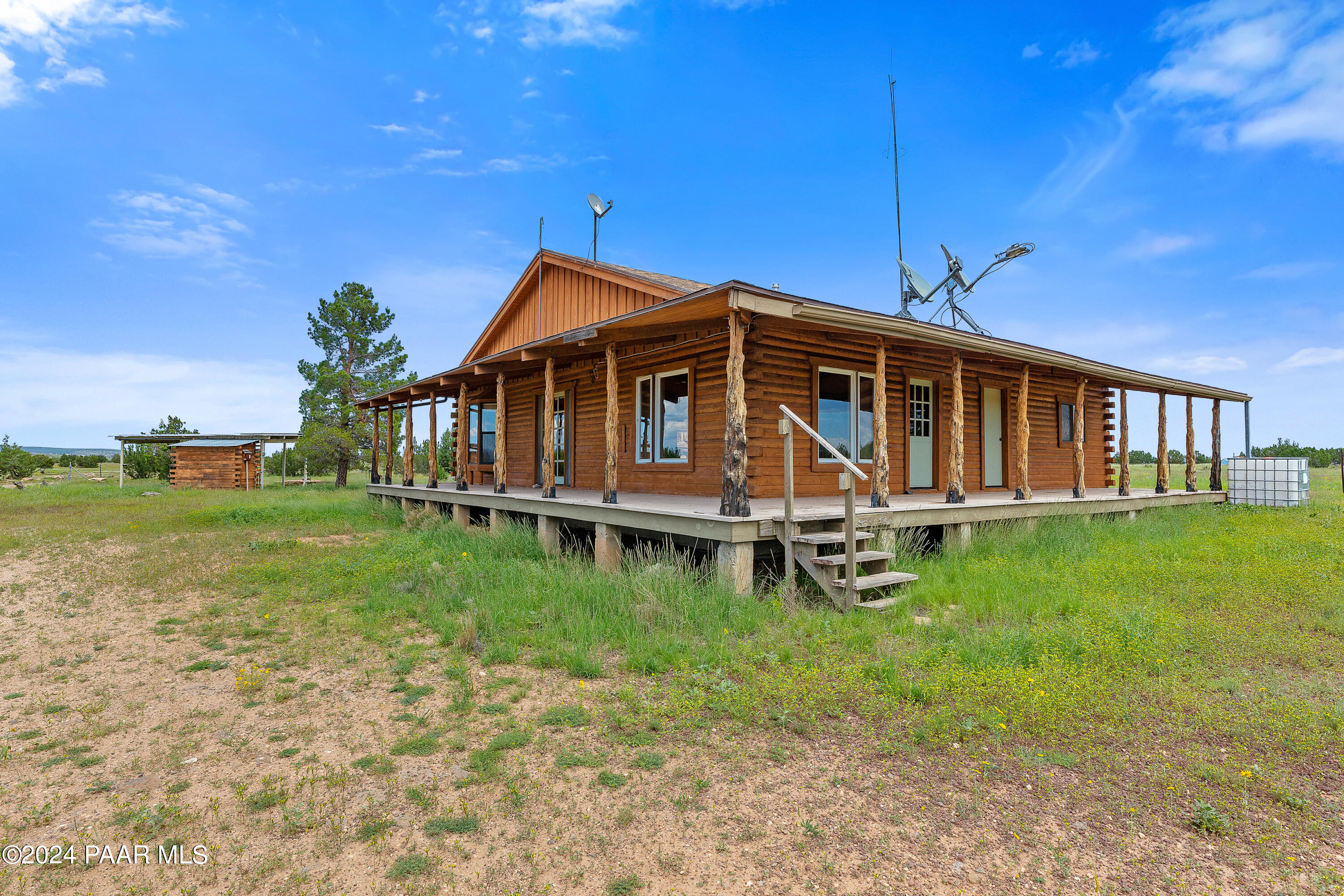 9797 Rocky Rabbit Road Ash Fork, AZ 86320 - Photo 24 of 36 a view of a house with a yard