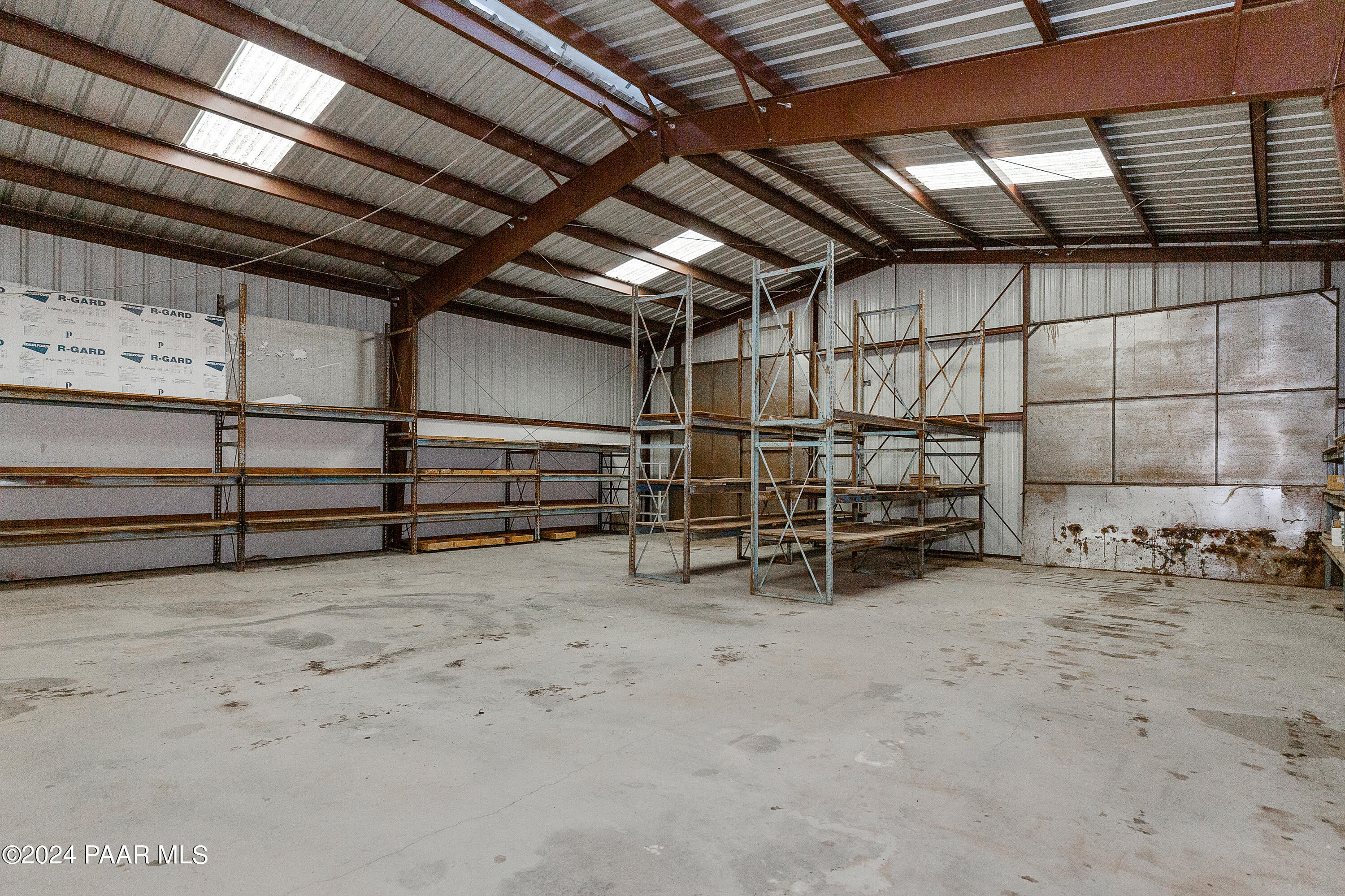 9797 Rocky Rabbit Road Ash Fork, AZ 86320 - Photo 28 of 36 a view of an empty room with racks