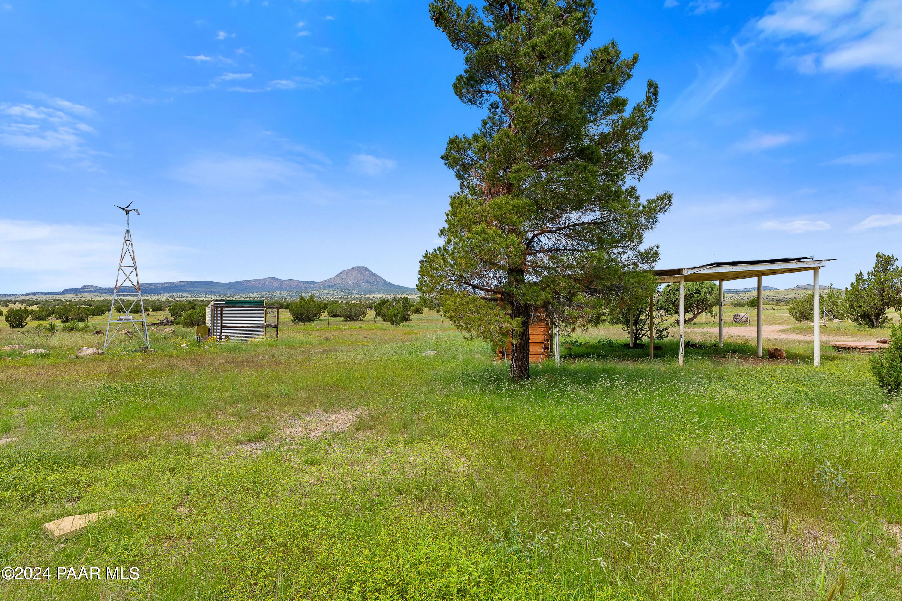 9797 Rocky Rabbit Road Ash Fork, AZ 86320 - Photo 31 of 36 a view of a swimming pool with a yard