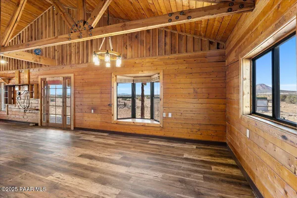 a view of front door of house with wooden stairs