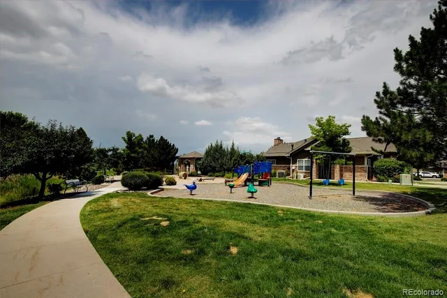 a view of a backyard with a garden and plants