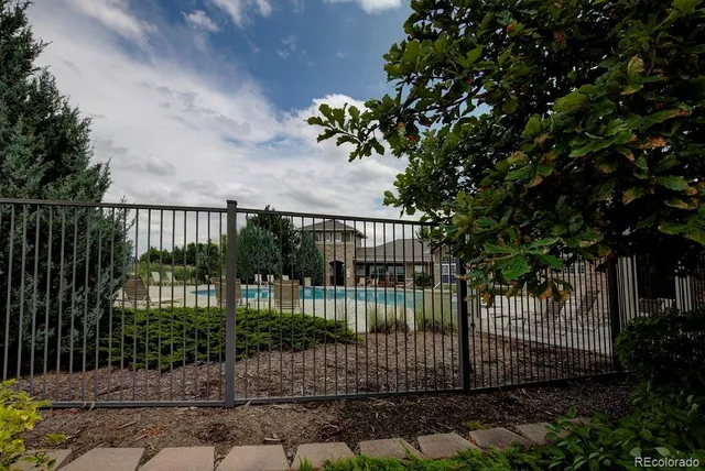 a view of a wrought iron fences in front of house