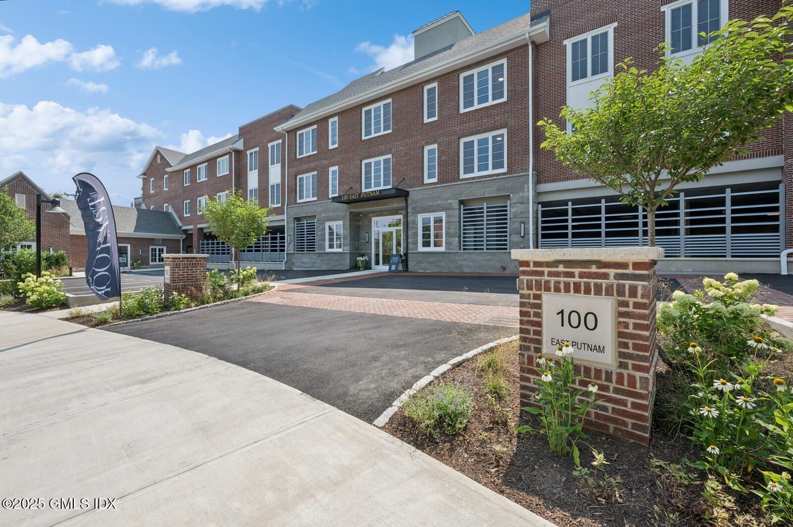 a front view of a building with garden