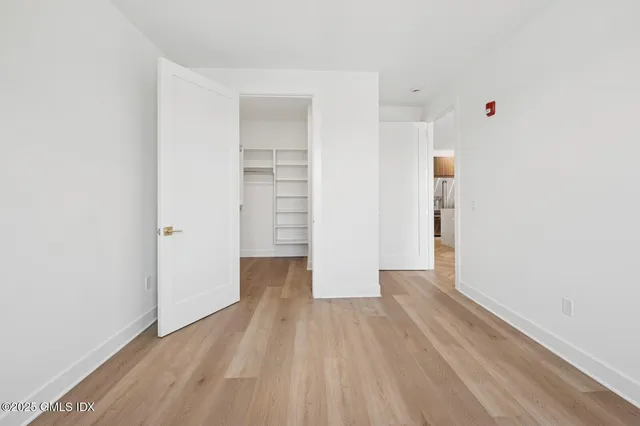 a view of wooden floor in an empty room