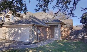 218-220 Rentz Pl Circle Weatherford, TX 76086 - Photo 1 of 1 a view of a stone house with a tree