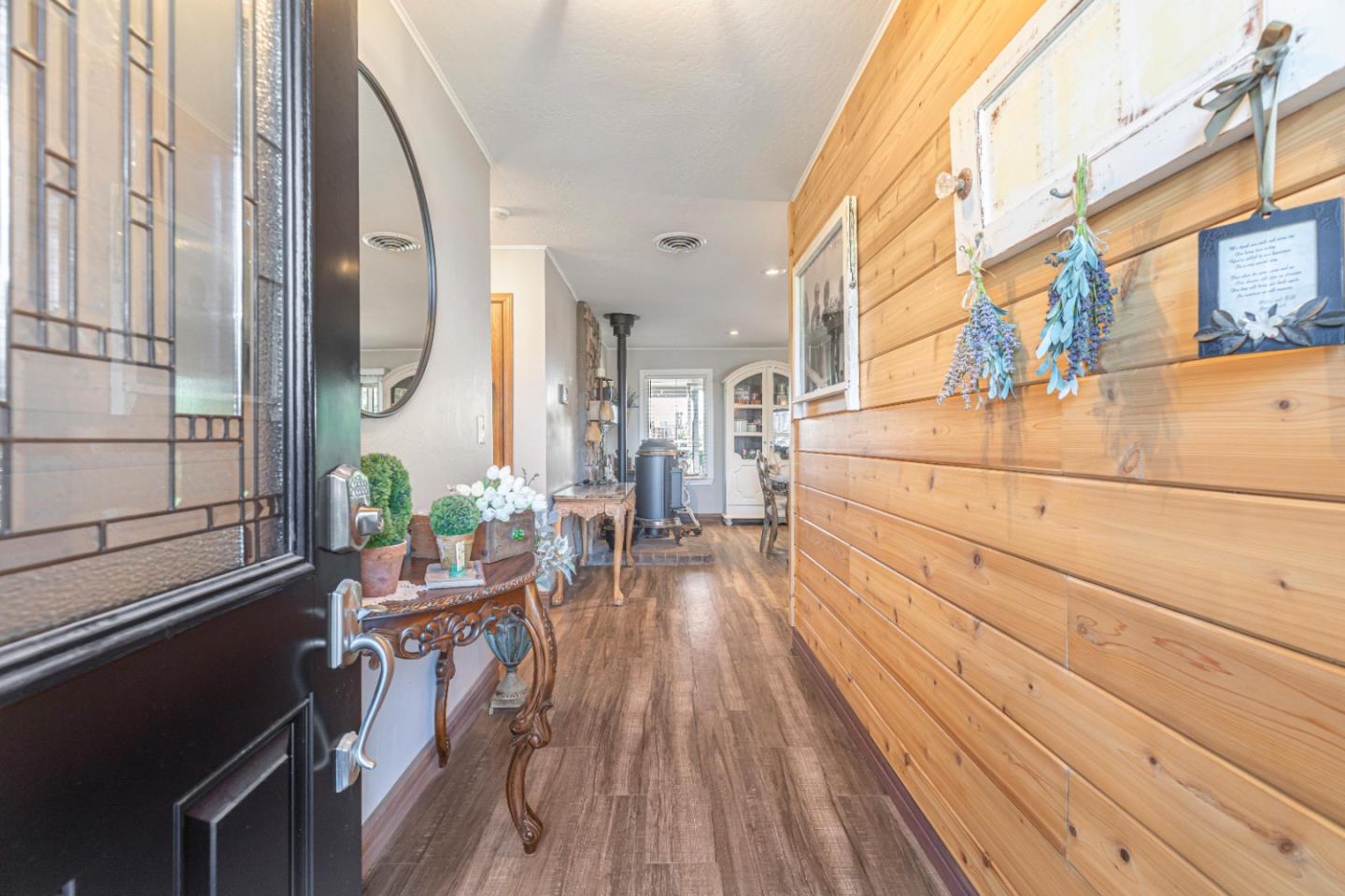 150 Jonquil Lane Hollister, CA 95023 - Photo 16 of 61 a view of a balcony with chairs and wooden floor