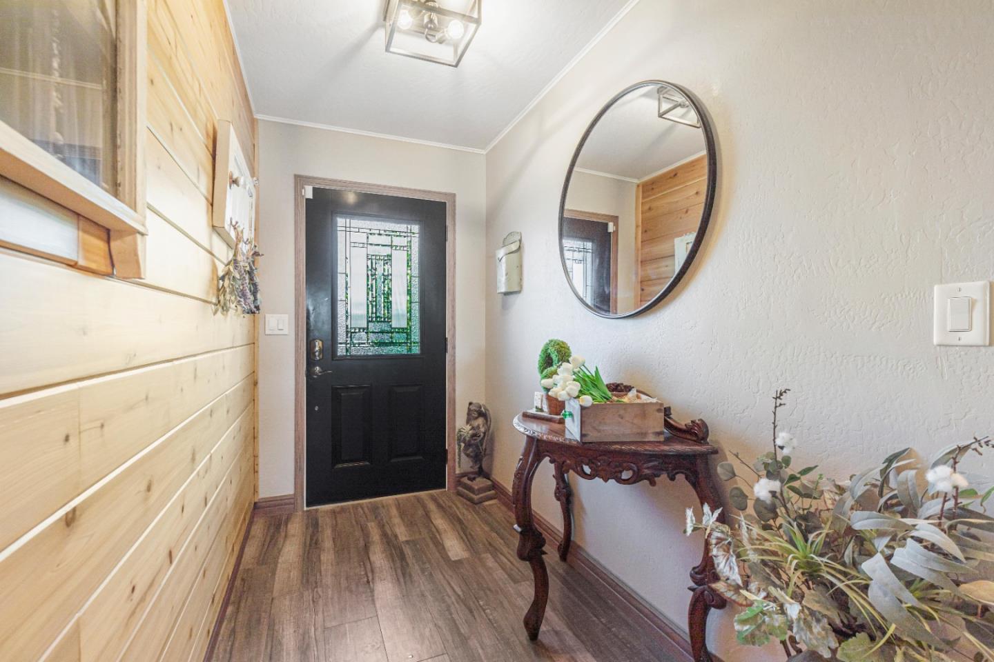 150 Jonquil Lane Hollister, CA 95023 - Photo 17 of 61 a room with painting on the wall and a wooden floor