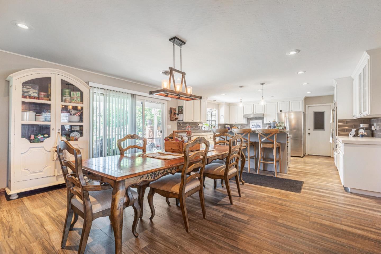 150 Jonquil Lane Hollister, CA 95023 - Photo 18 of 61 a view of a dining room with furniture window and wooden floor