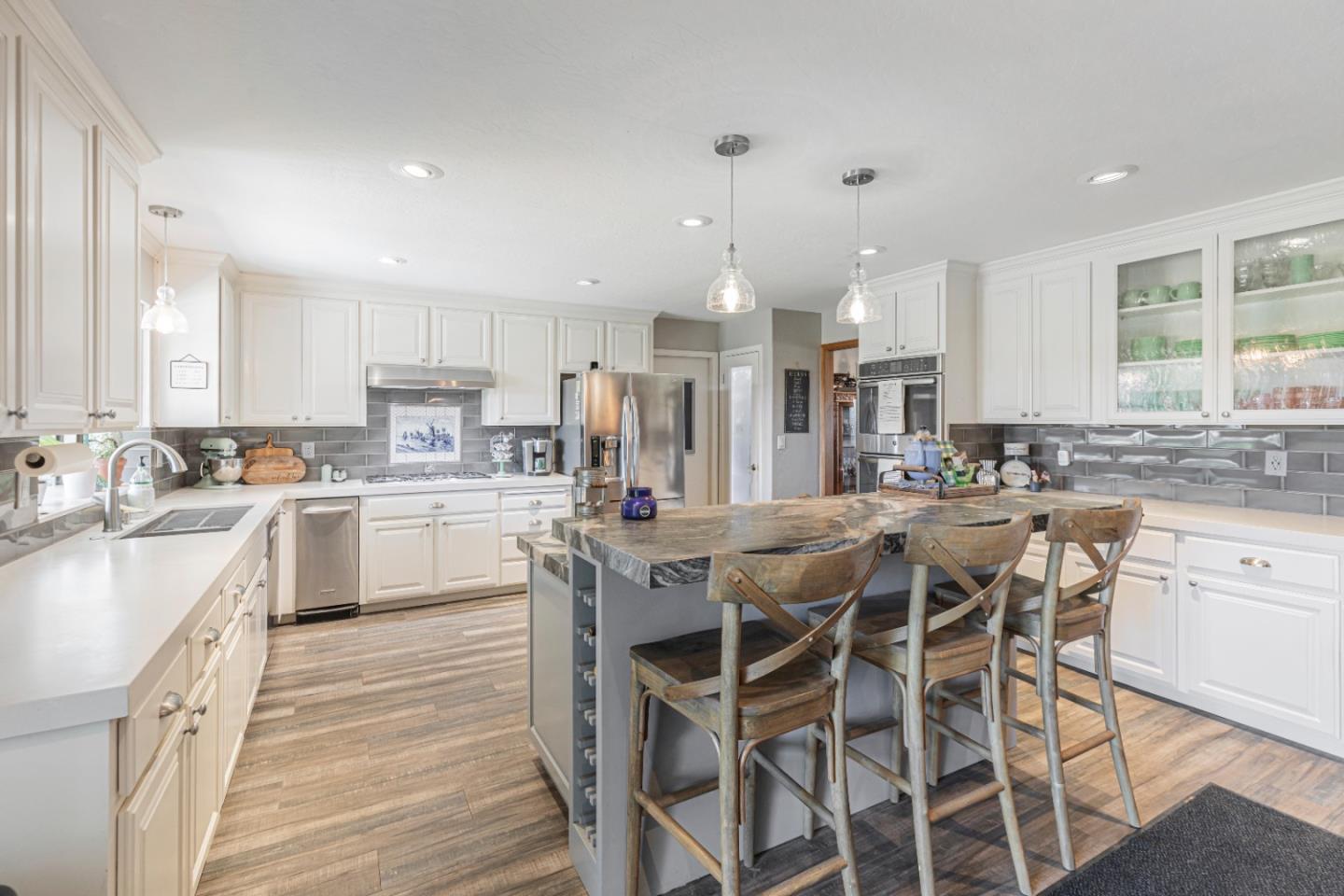 150 Jonquil Lane Hollister, CA 95023 - Photo 21 of 61 a kitchen with appliances a sink and cabinets