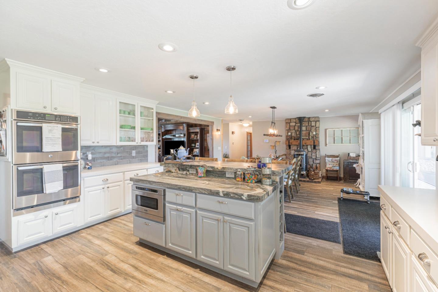 150 Jonquil Lane Hollister, CA 95023 - Photo 22 of 61 a kitchen with a sink stove and cabinets