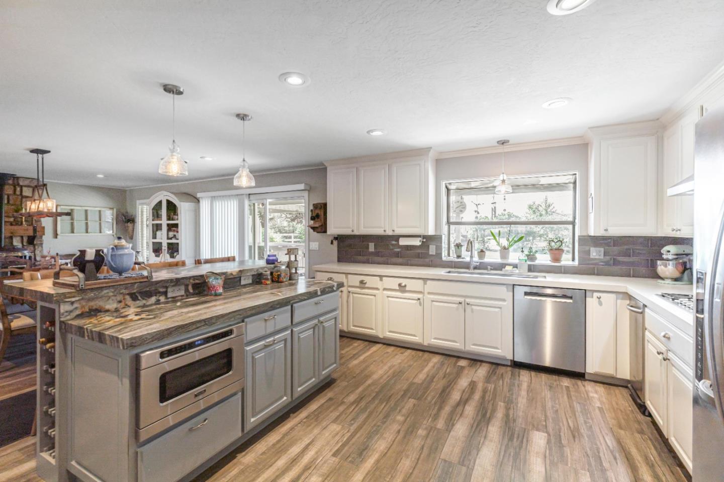 150 Jonquil Lane Hollister, CA 95023 - Photo 23 of 61 a kitchen with a stove sink and cabinets