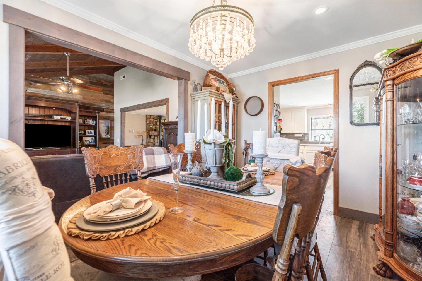 150 Jonquil Lane Hollister, CA 95023 - Photo 26 of 61 a dining room with furniture a chandelier and wooden floor
