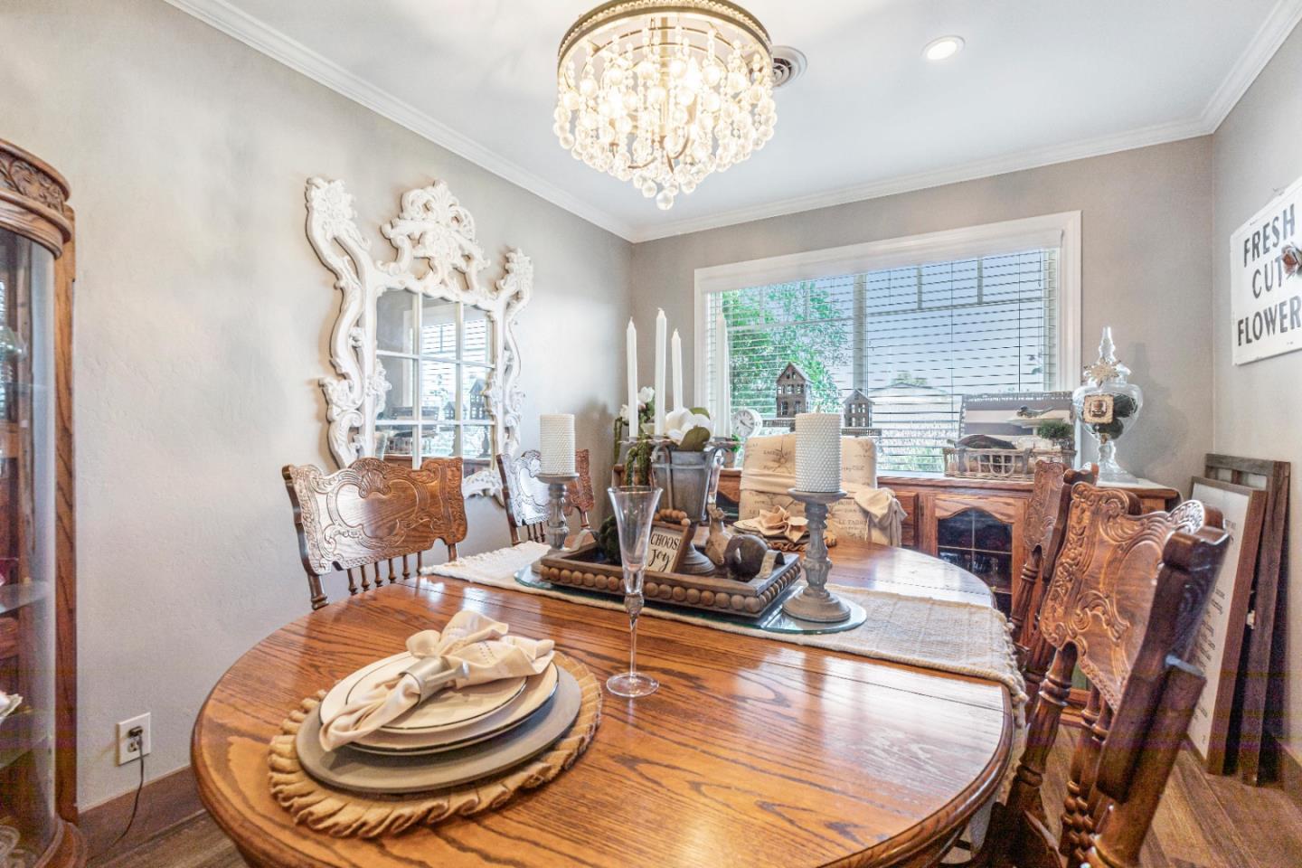 150 Jonquil Lane Hollister, CA 95023 - Photo 27 of 61 a room with furniture a large window and wooden floor