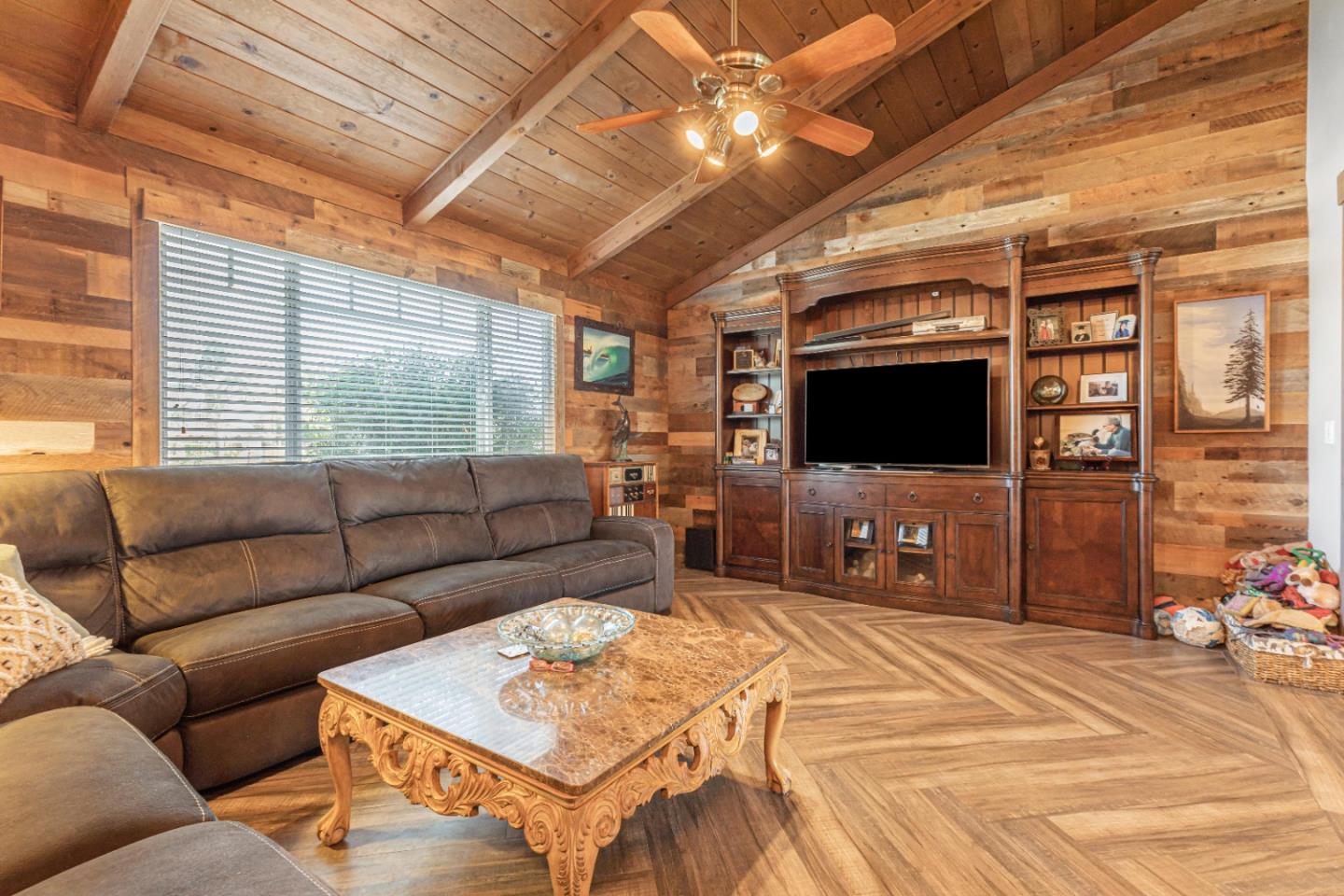 150 Jonquil Lane Hollister, CA 95023 - Photo 29 of 61 a living room with furniture and a flat screen tv
