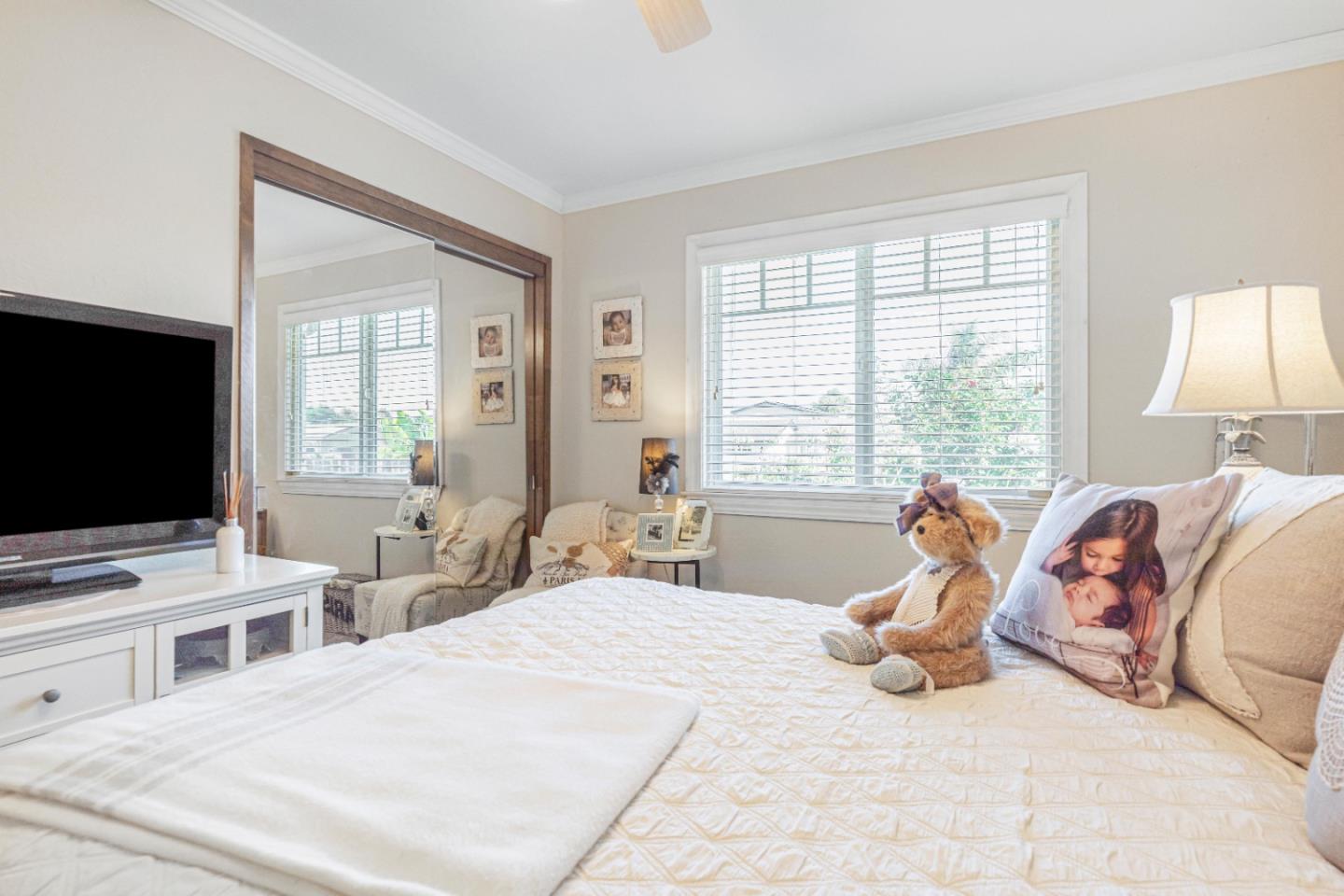 150 Jonquil Lane Hollister, CA 95023 - Photo 35 of 61 a bedroom with a bed and a flat screen tv