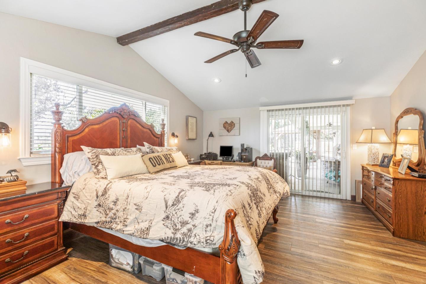 150 Jonquil Lane Hollister, CA 95023 - Photo 42 of 61 a spacious bedroom with a bed a dresser and wooden floor