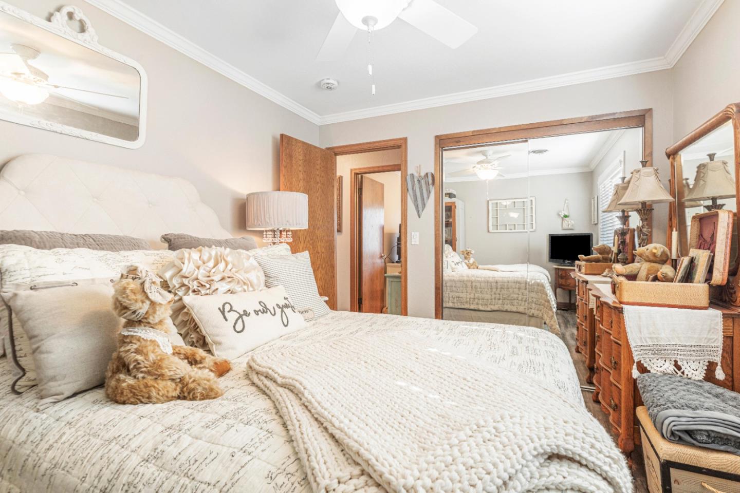 150 Jonquil Lane Hollister, CA 95023 - Photo 45 of 61 a bedroom with a large bed and a chandelier