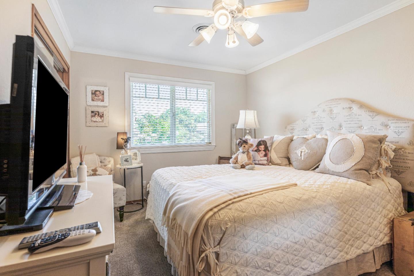 150 Jonquil Lane Hollister, CA 95023 - Photo 46 of 61 a bedroom with a bed and a flat screen tv