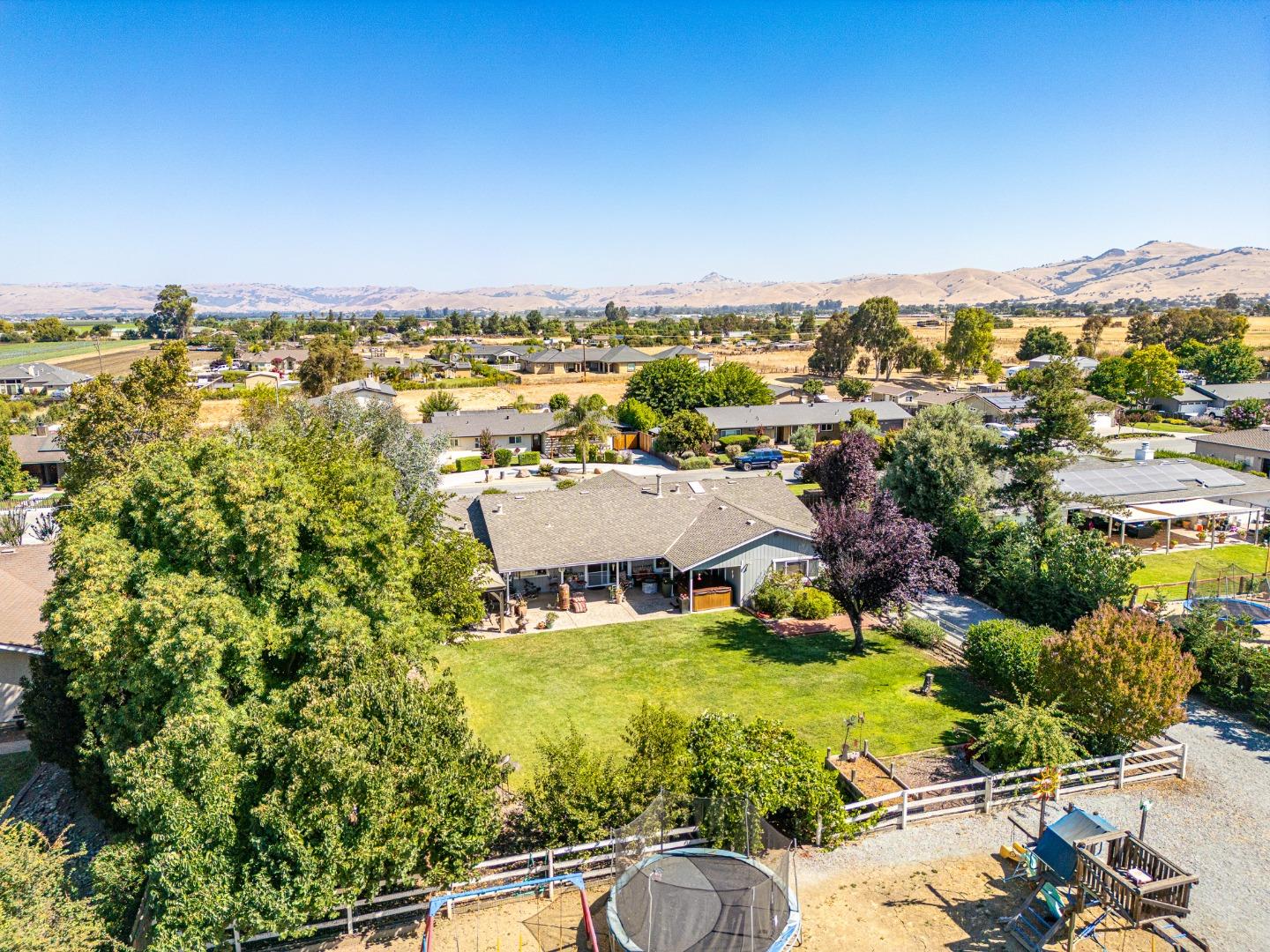 150 Jonquil Lane Hollister, CA 95023 - Photo 50 of 61 an aerial view of residential houses with outdoor space and trees