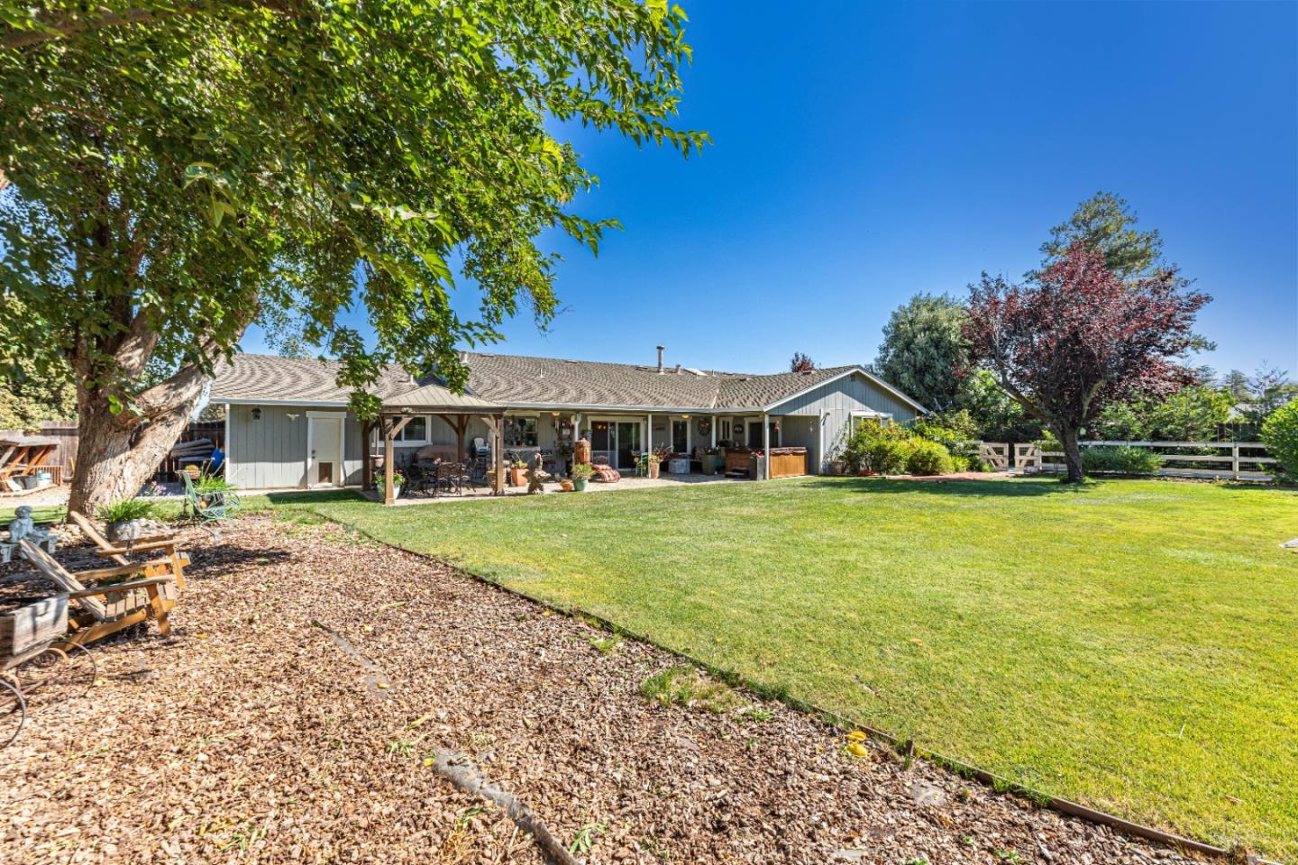 150 Jonquil Lane Hollister, CA 95023 - Photo 9 of 61 a front view of a house with a garden