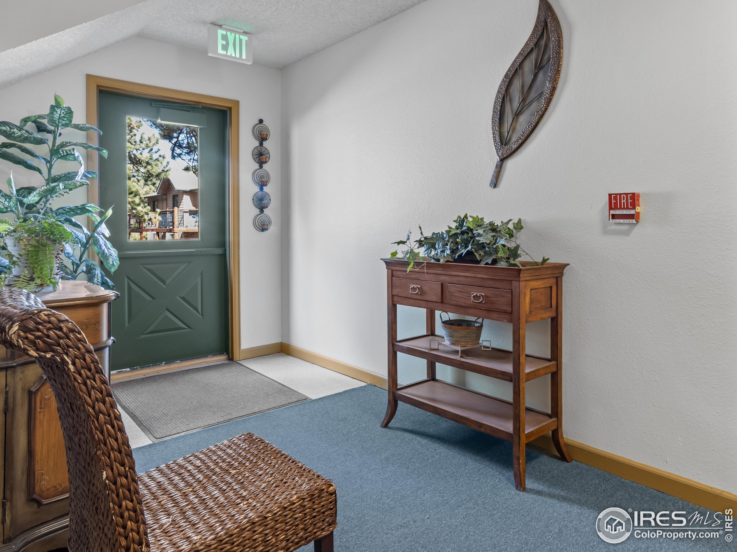 1155 South St Vrain Avenue, Unit 13 Estes Park, CO 80517 - Photo 15 of 18 a living room with furniture and a window