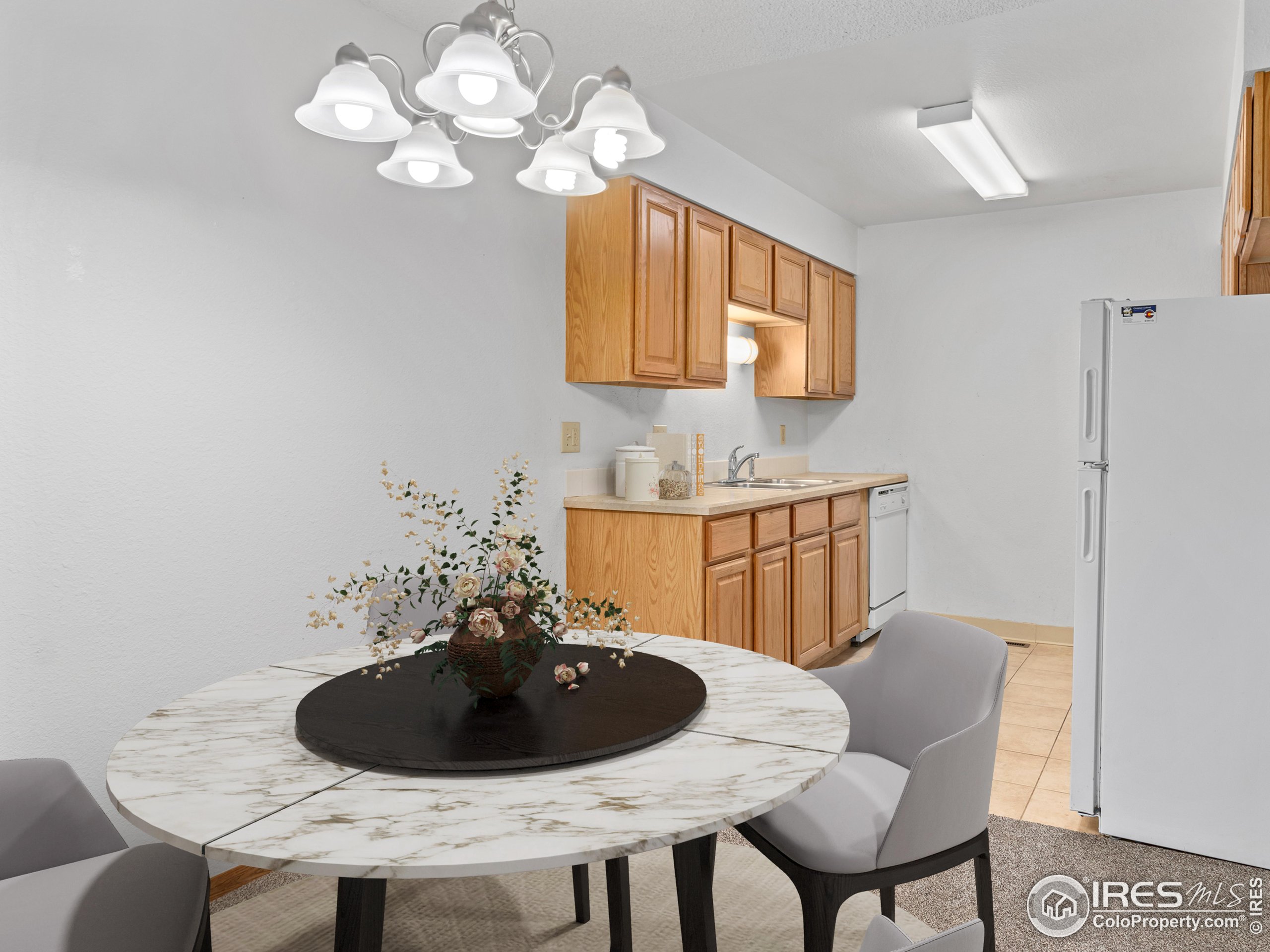 1155 South St Vrain Avenue, Unit 13 Estes Park, CO 80517 - Photo 6 of 18 a table and chairs in a room