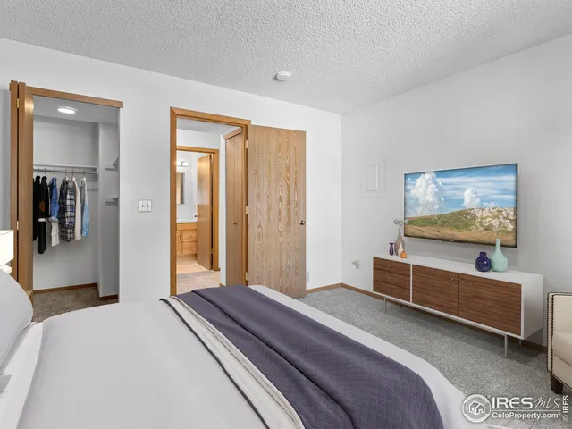 a bedroom with furniture and window