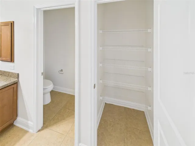 a bathroom with a vanity and a toilet
