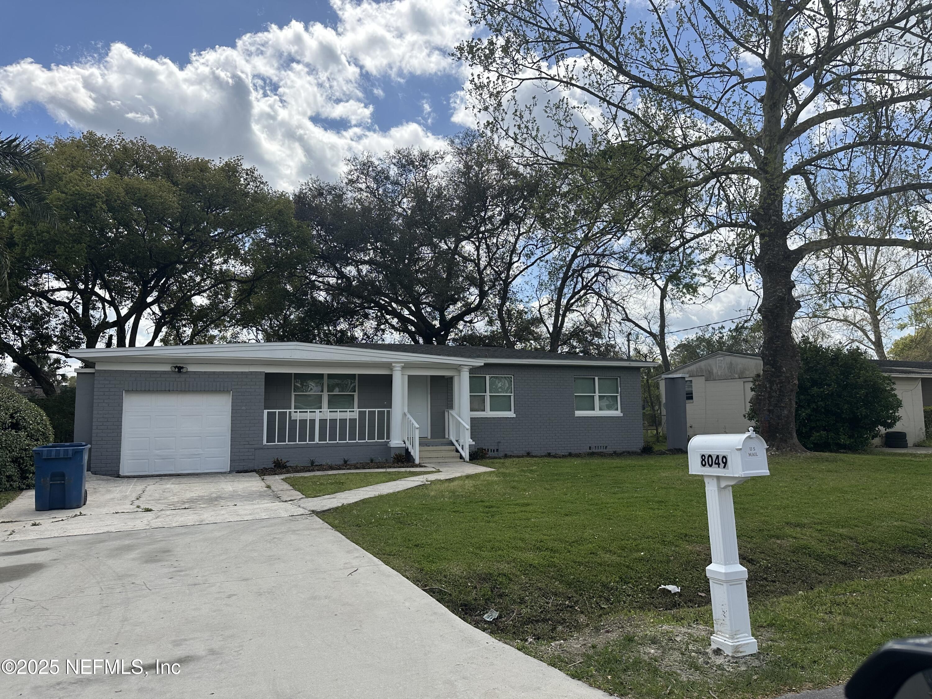 8049 Ramsgate Road Jacksonville, FL 32208 - Photo 3 of 14 a front view of house with yard and green space