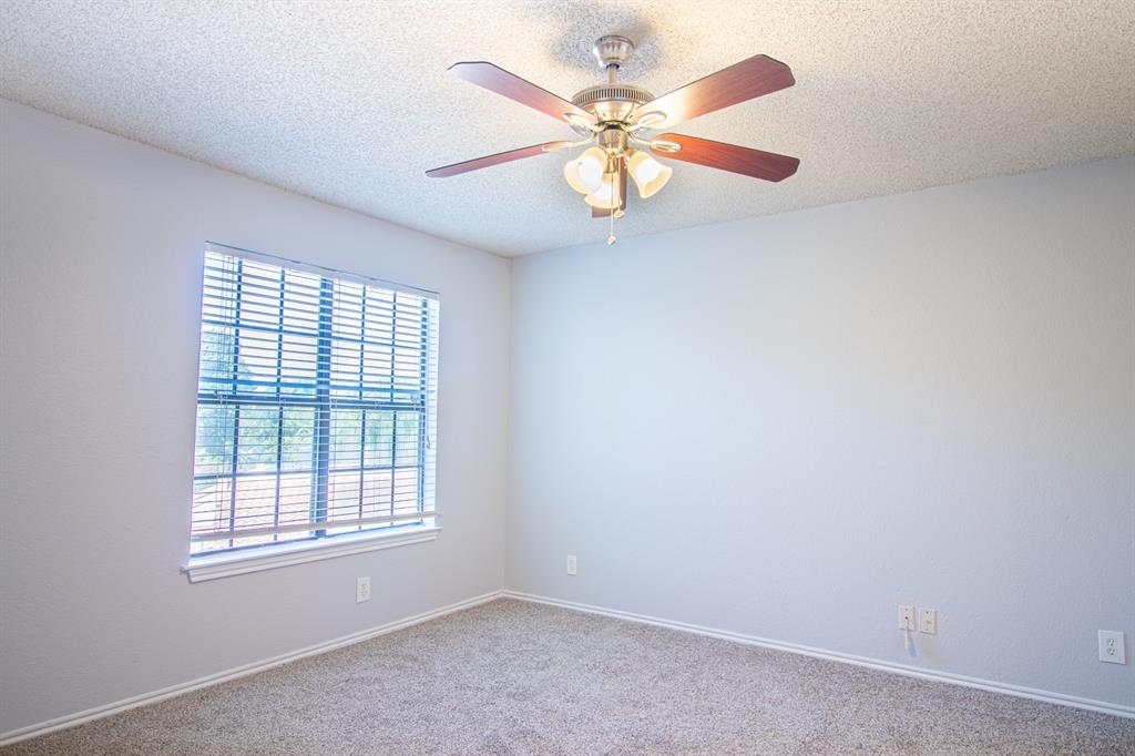 4777 Cedar Springs Road, Unit 4D Dallas, TX 75219 - Photo 13 of 20 an empty room with windows and fan